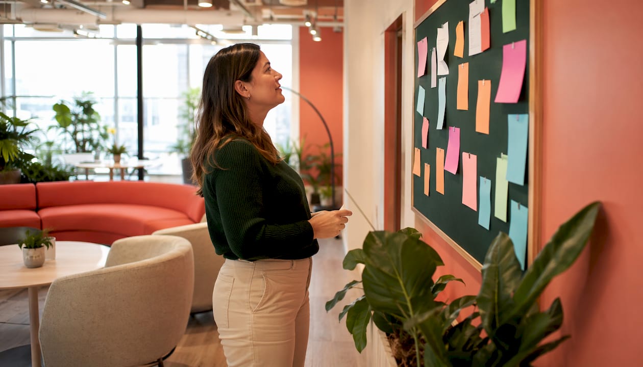 Woman searching desk items during scavenger hunt